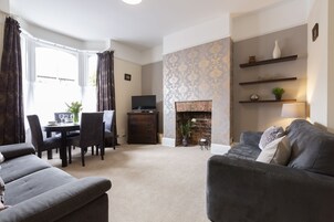 Apartment, 2 Bedrooms (Triple Sleeper Bunk Bed) | Living room | Flat-screen TV, DVD player