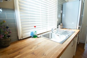 Apartment, 2 Bedrooms (Triple Sleeper Bunk Bed) | Private kitchenette | Fridge, microwave, stovetop, dishwasher