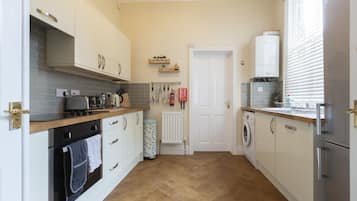 Apartment, 2 Bedrooms (Triple Sleeper Bunk Bed) | Private kitchen | Fridge, microwave, stovetop, dishwasher