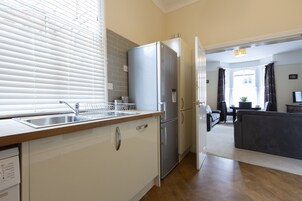 Apartment, 2 Bedrooms (Triple Sleeper Bunk Bed) | Private kitchen | Fridge, microwave, stovetop, dishwasher