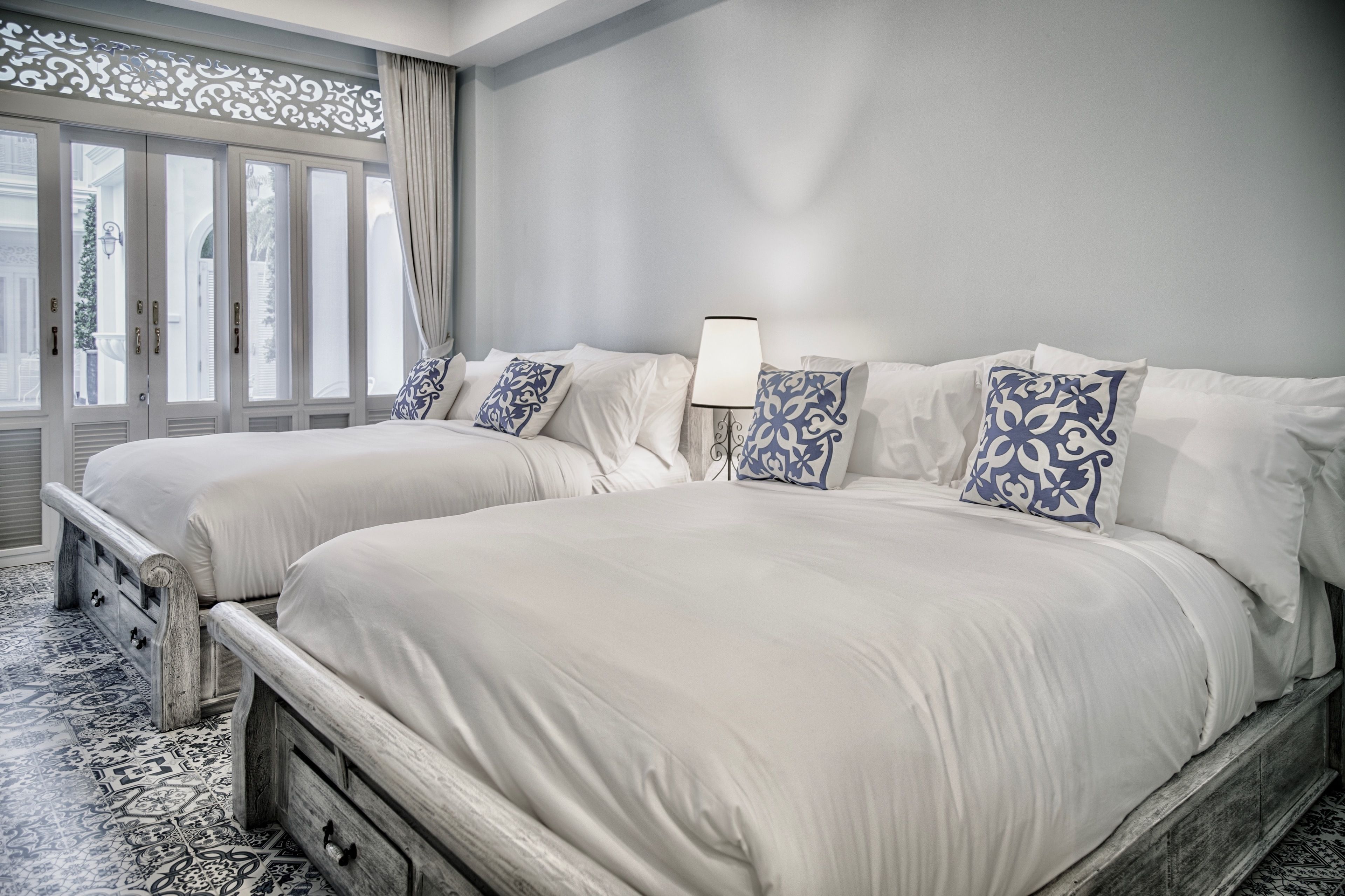 deluxe queen twin bed pool view | free minibar, in-room safe, laptop workspace, iron/ironing board