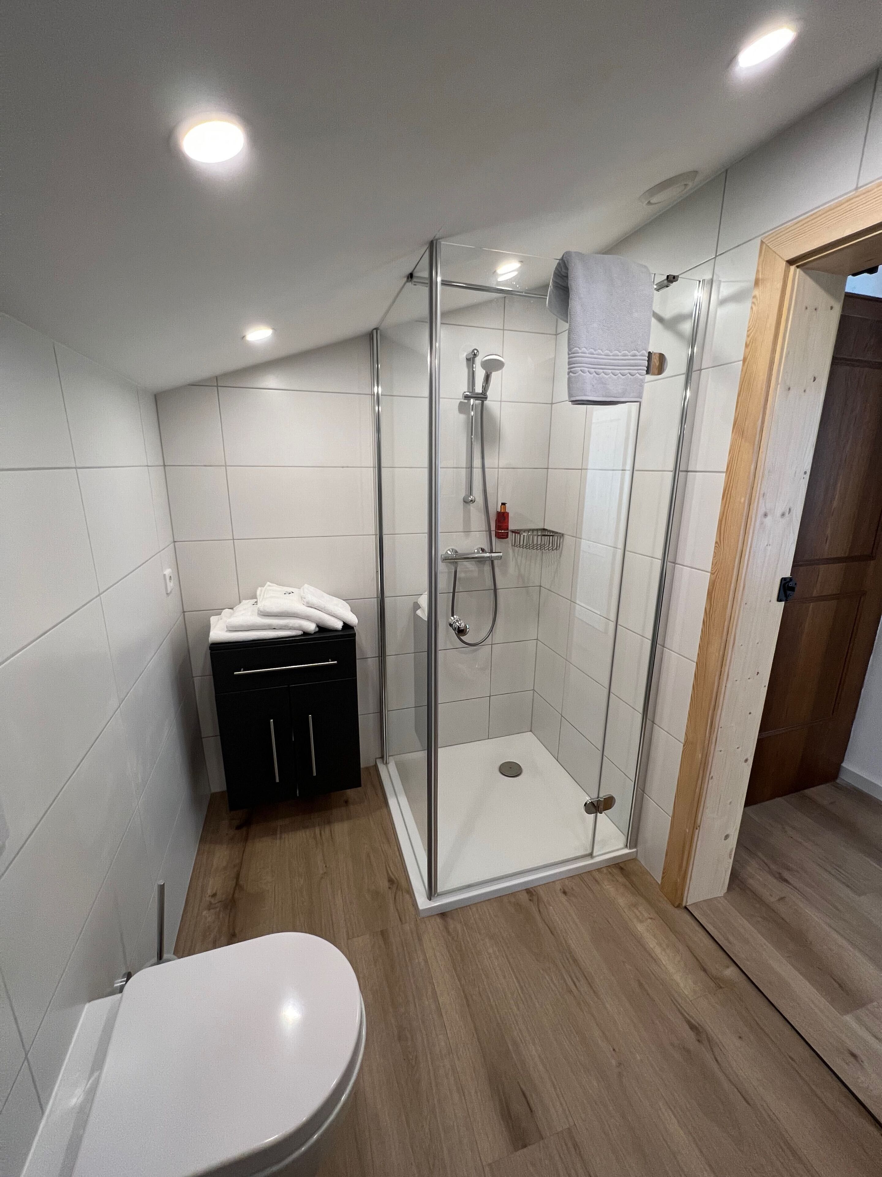 family room, 2 bedrooms, balcony, mountain view | bathroom | free toiletries, hair dryer, towels, soap