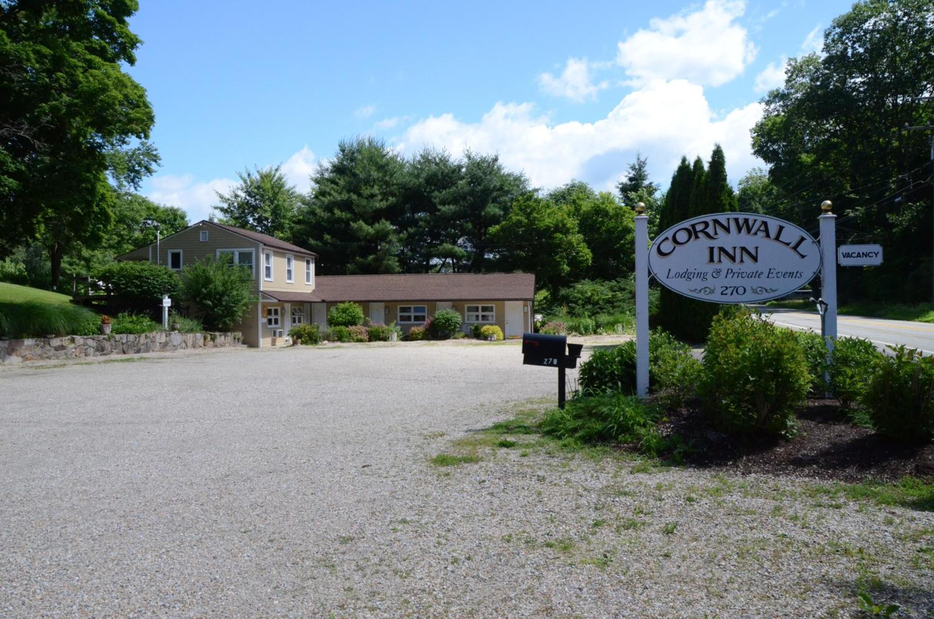 A sign for Cornwall Inn indicating it offers lodging and private events.
