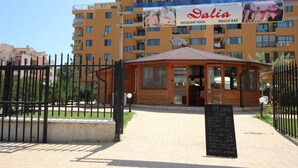 A snack bar named 'Dalia' with a menu board in front. - Menada Amadeus 3 Apartments (Sunny Beach)