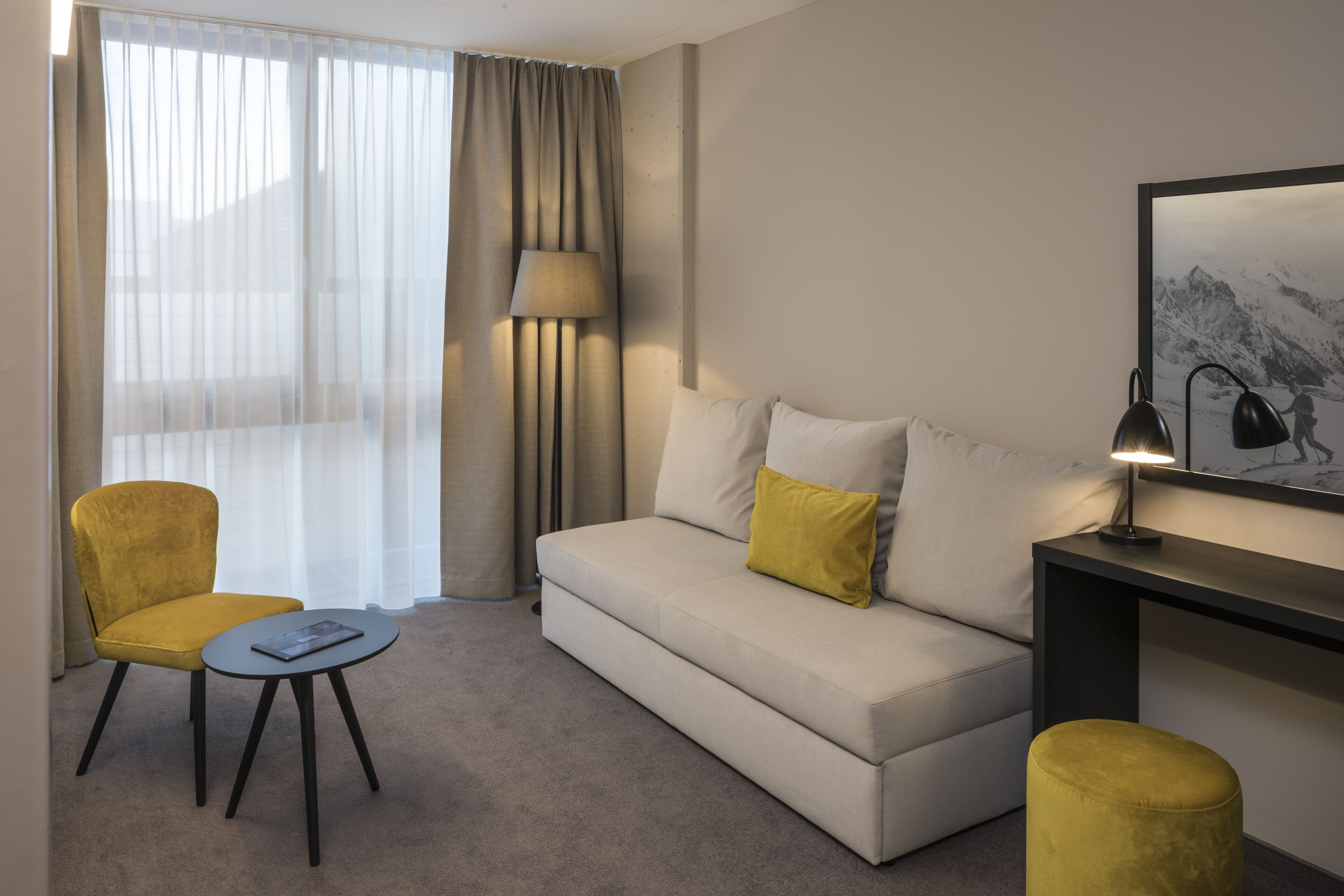 junior suite | living area | flat-screen tv, heated floors