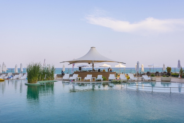 Indoor pool, seasonal outdoor pool, pool umbrellas, sun loungers