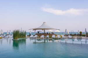 Indoor pool, seasonal outdoor pool, pool umbrellas, sun loungers