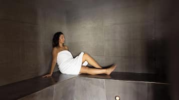 Relax in a sleek, dark-toned bathtub, part of a contemporary space with clean lines.