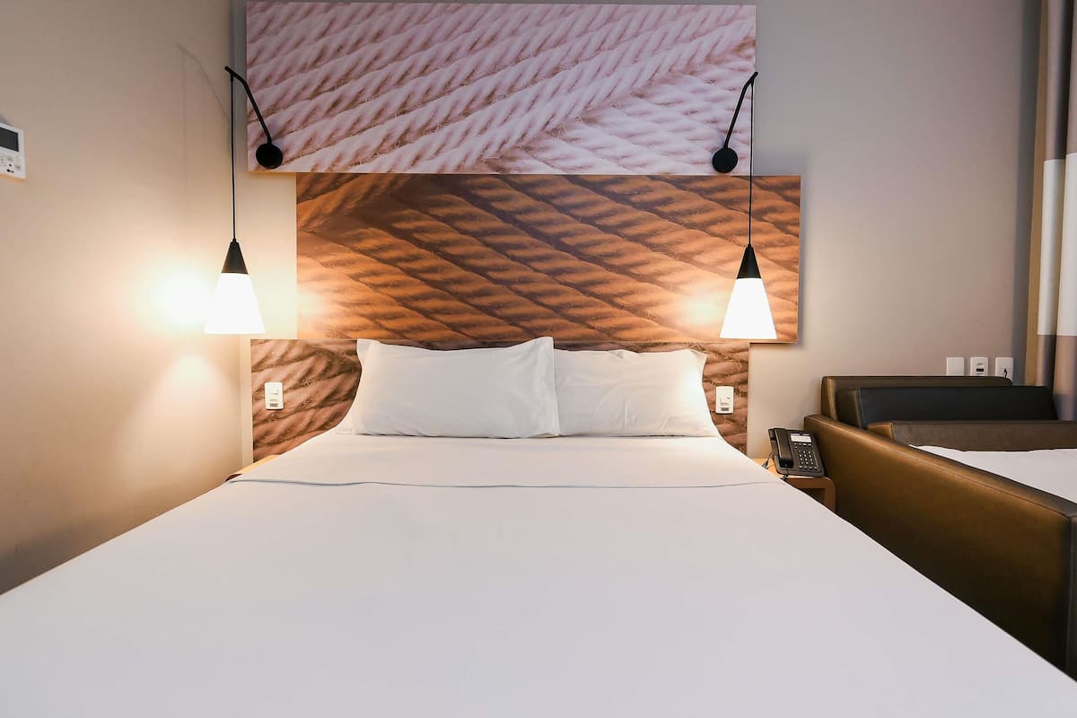 Standard Room, Multiple Beds | Minibar, in-room safe, desk, blackout drapes