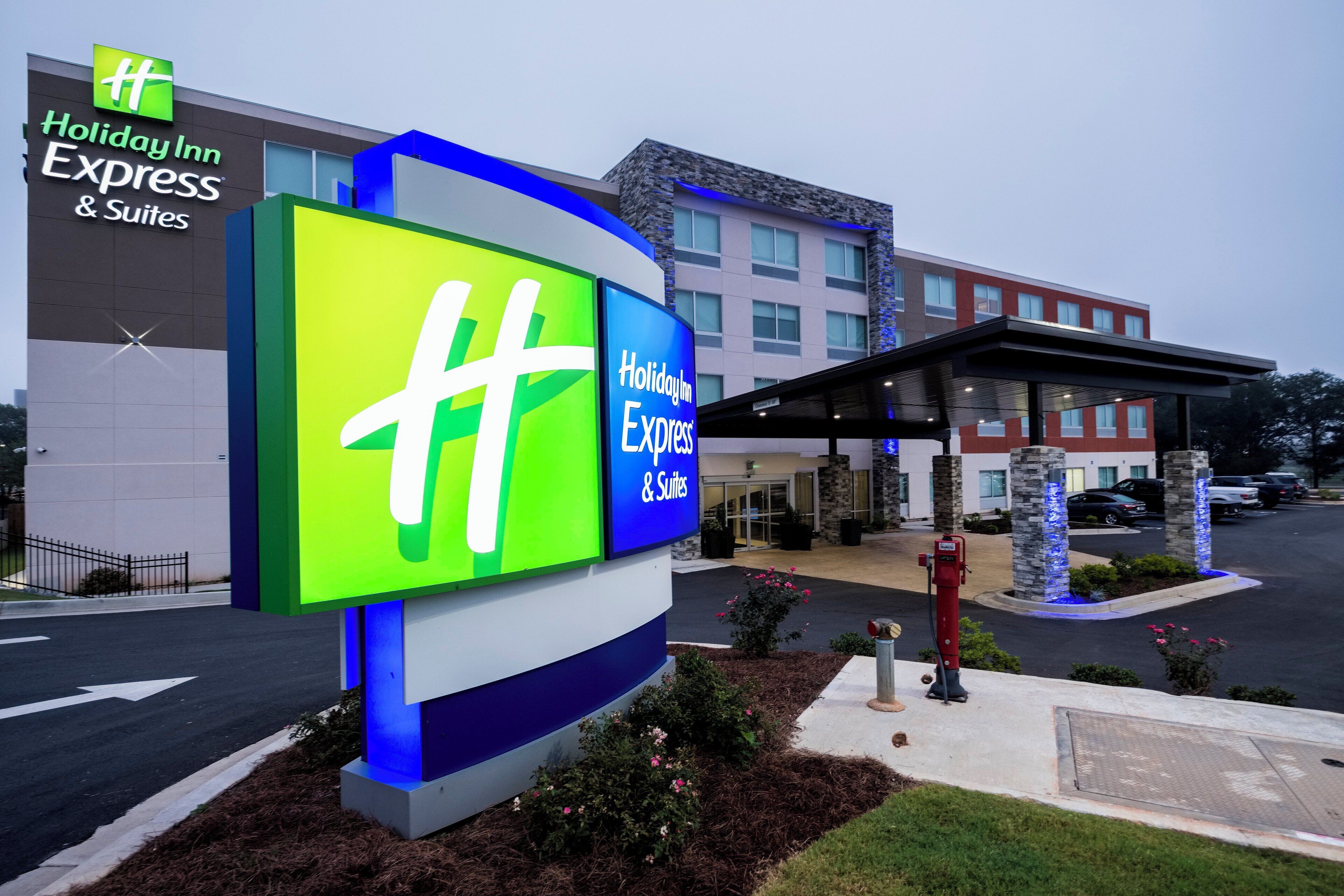 A Holiday Inn Express & Suites building with a prominent 'Holiday Inn Express' sign.