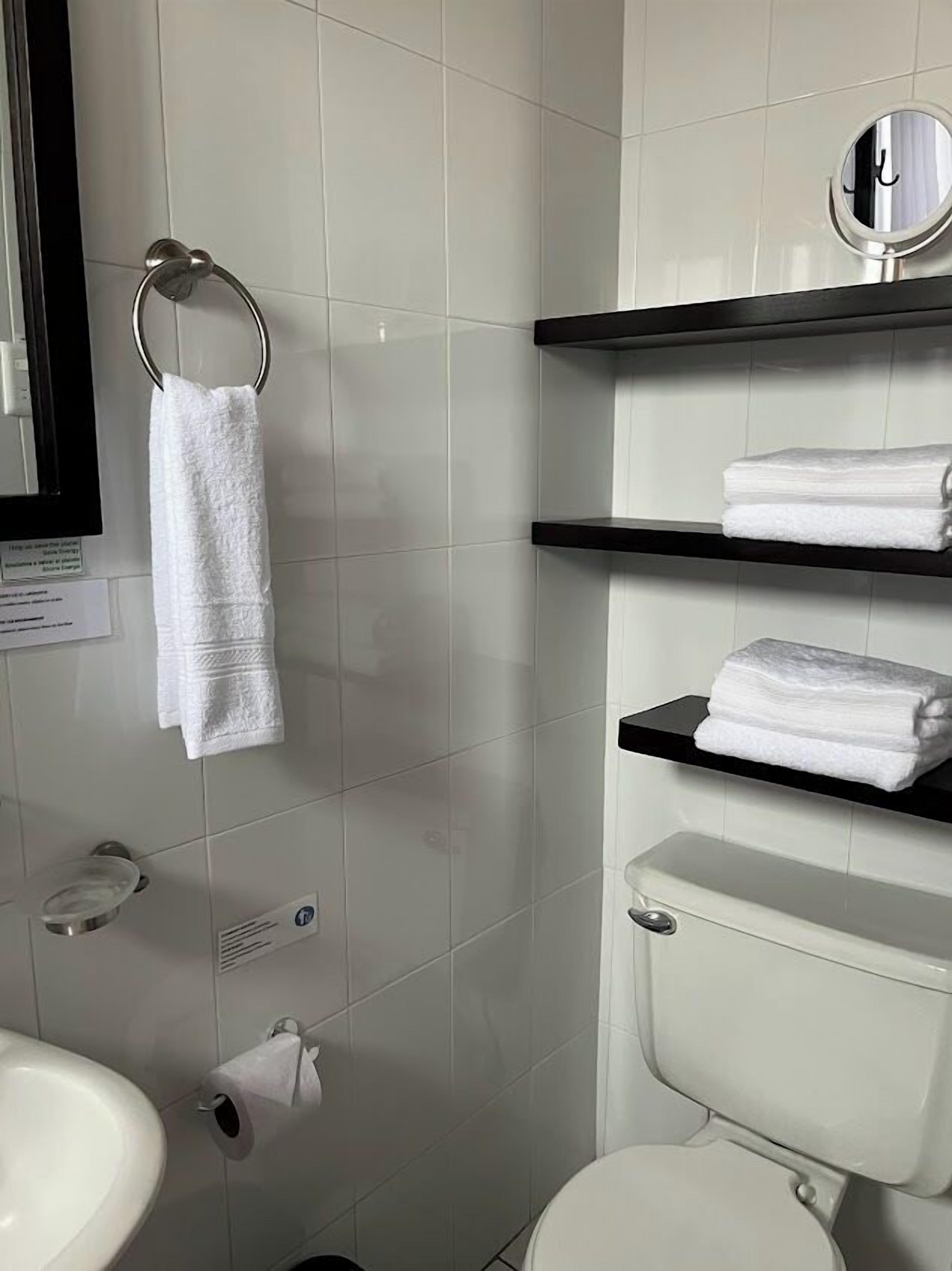 deluxe room, 1 queen bed | bathroom | shower, free toiletries, hair dryer, towels