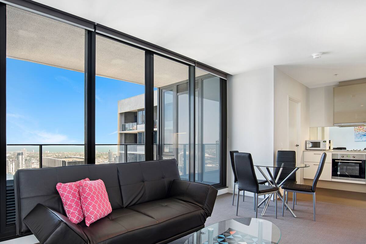 Deluxe Two Bedroom Apartment | Living area | Flat-screen TV