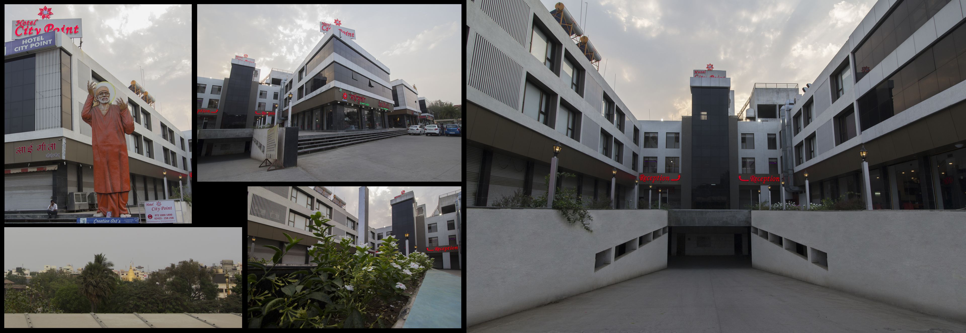 A hotel with a modern design, featuring a reception area, multiple floors, and a view of the surrounding cityscape.
