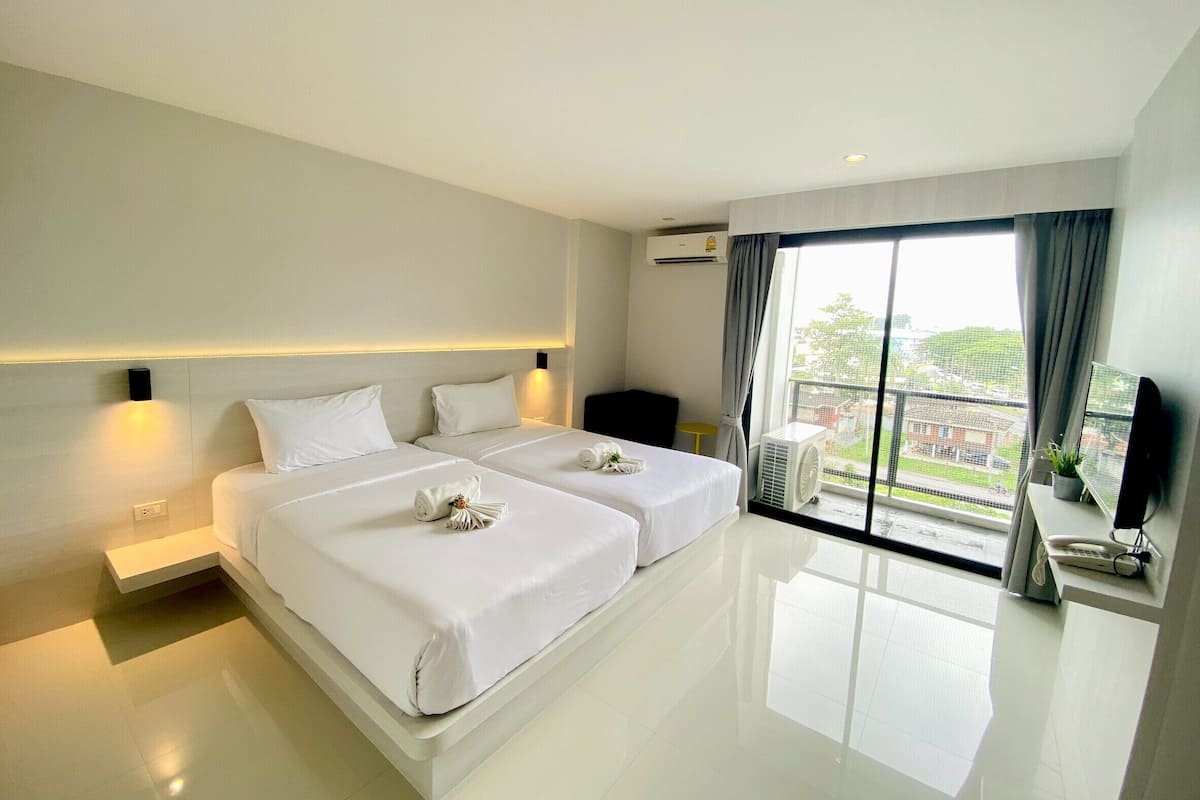 Quarto duplo standard | Frigobar, cortinas blackout, Wi-Fi de cortesia, roupa de cama