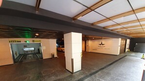 A spacious hotel lobby with a modern design, featuring a large reception desk, a prominent hotel logo, and a clean, well-lit environment. - Hotel Star Premier Yeoksam (Seoul)