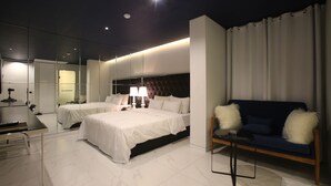 A modern hotel room with a large bed, a sofa, a desk, and a mirror. - Hotel Star Premier Yeoksam (Seoul)
