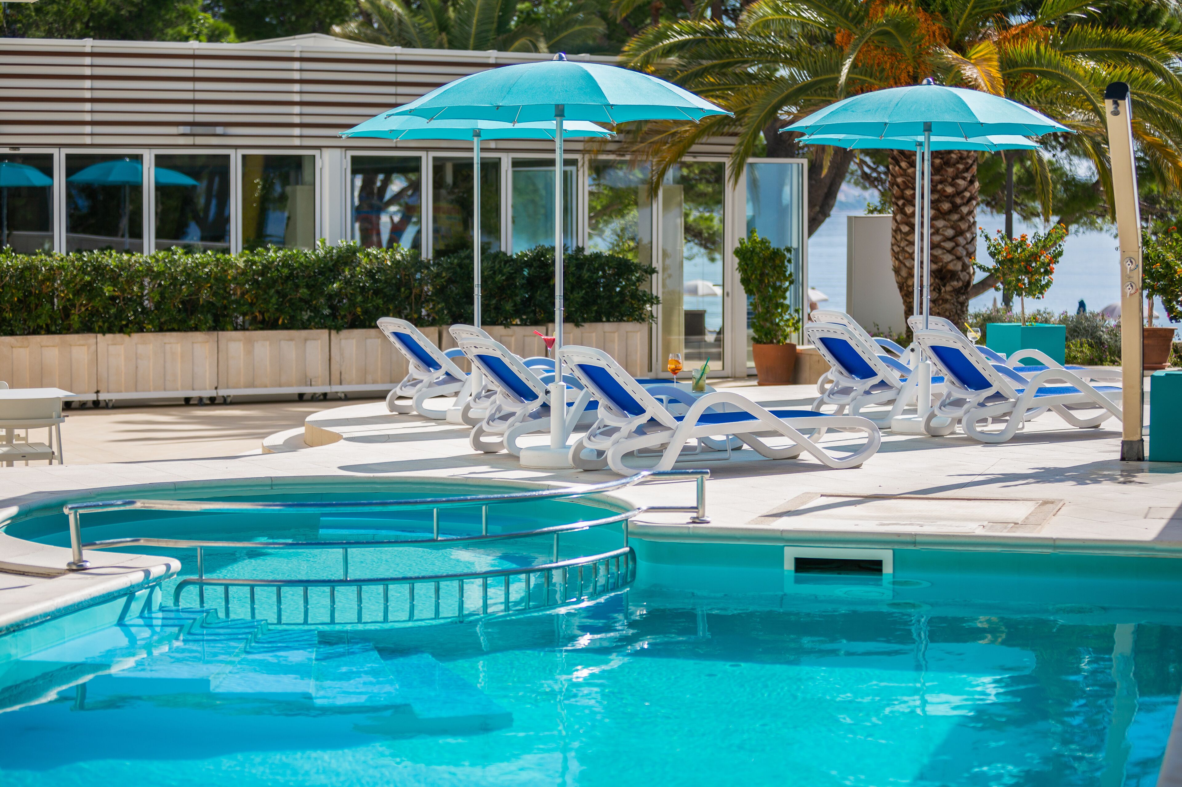 seasonal outdoor pool, open 8:00 am to 6:30 pm, pool umbrellas