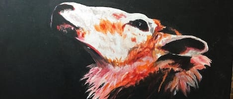 A painting of a dog with a red and white coat, set against a dark background.