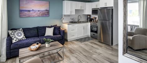 One Bedroom Studio, Queen Suite | Living room | LCD TV