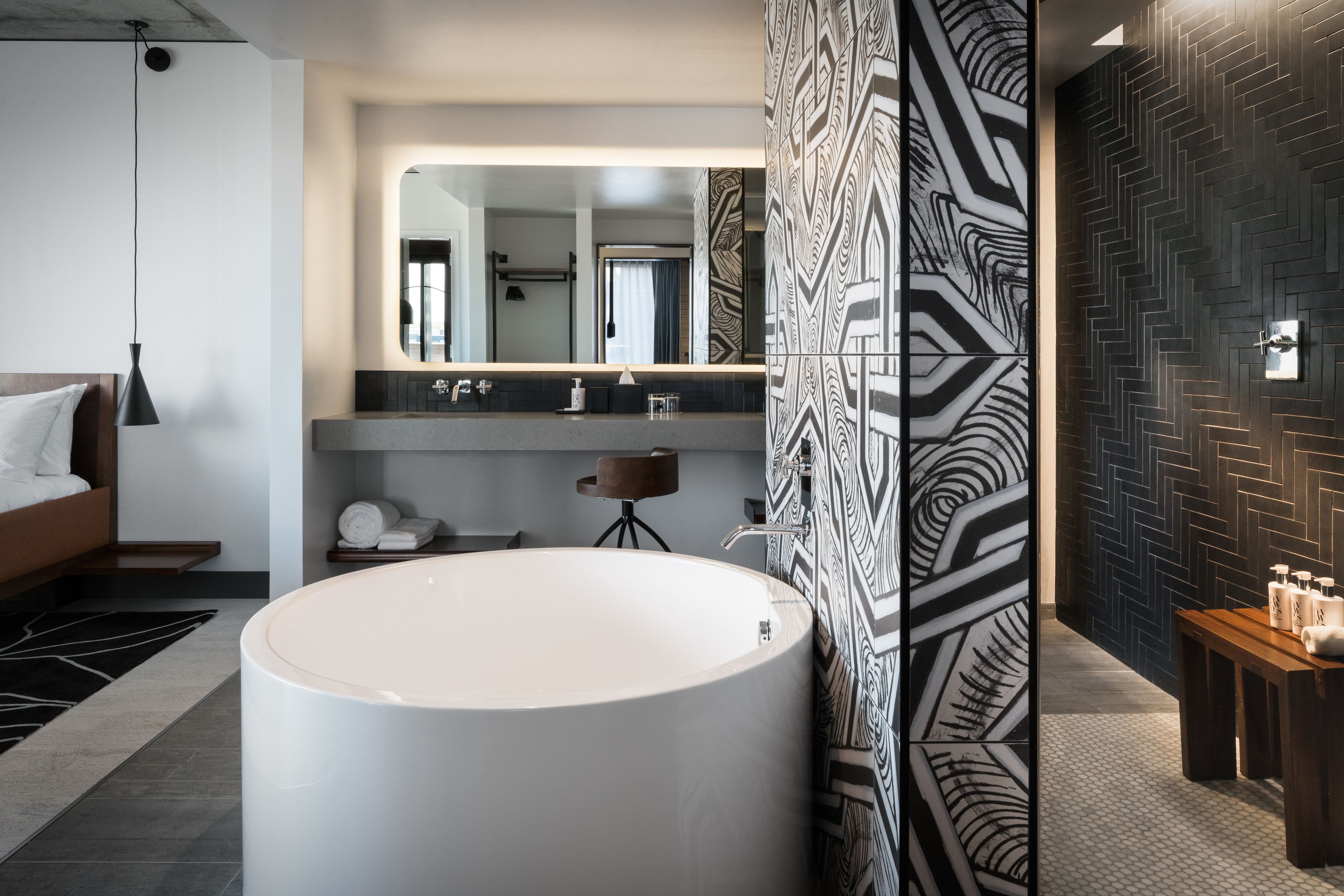 combined shower/bathtub, designer toiletries, bathrobes, towels