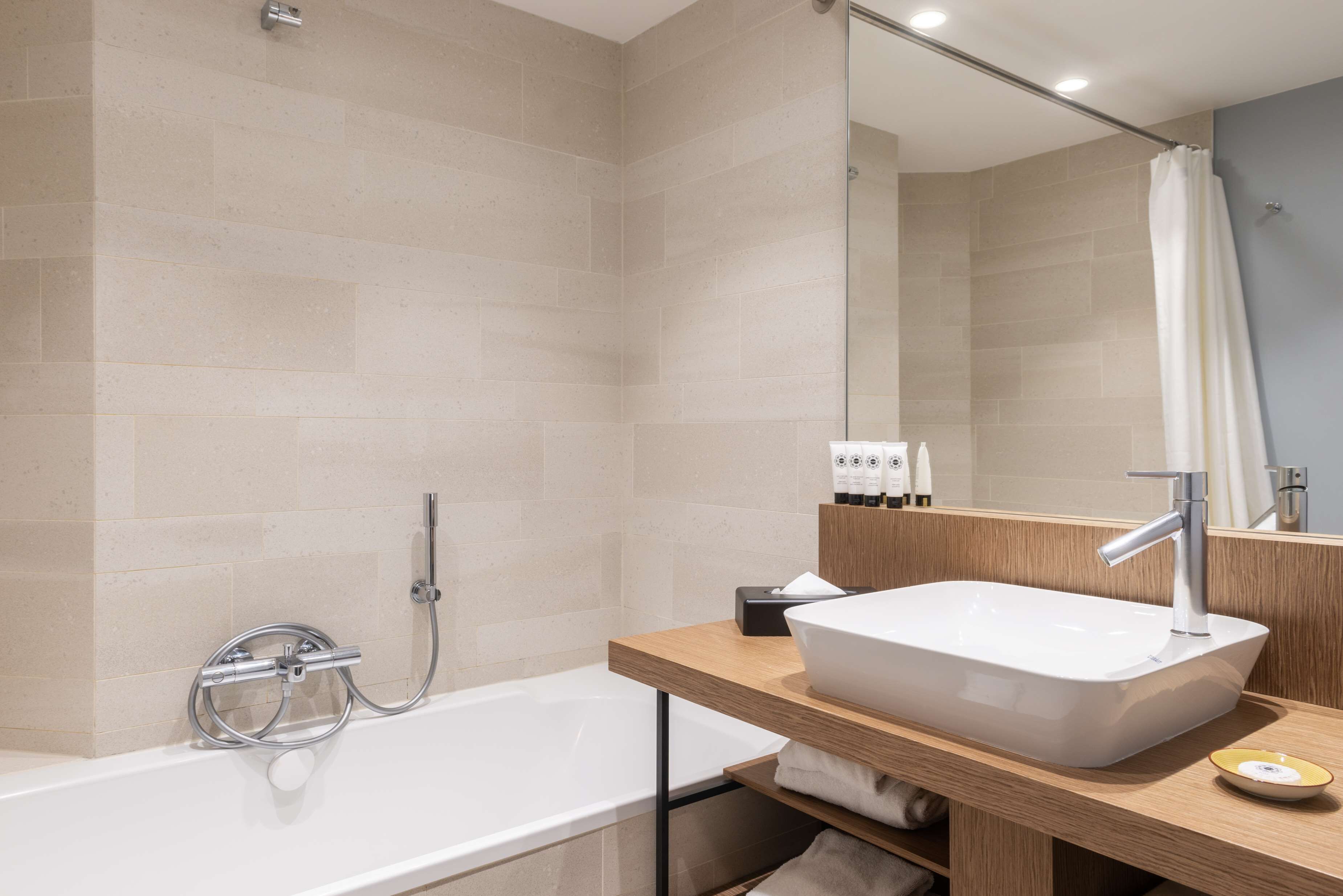 eco-friendly toiletries, hair dryer, slippers, towels