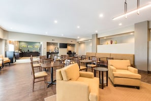 Relax in our spacious lobby with comfortable seating and ample dining space.