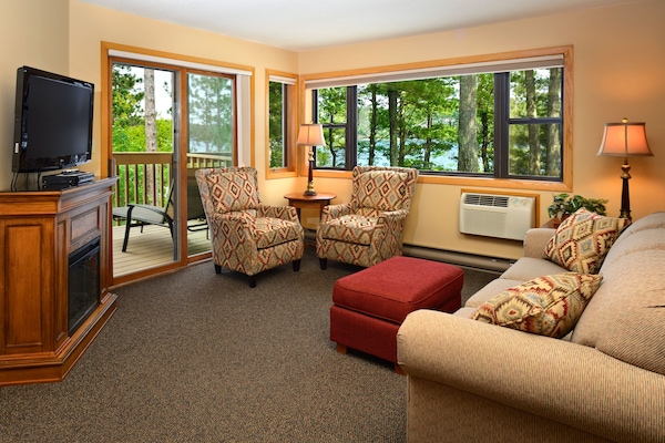 Premier Condo, 1 Bedroom | Living area | LED TV, fireplace