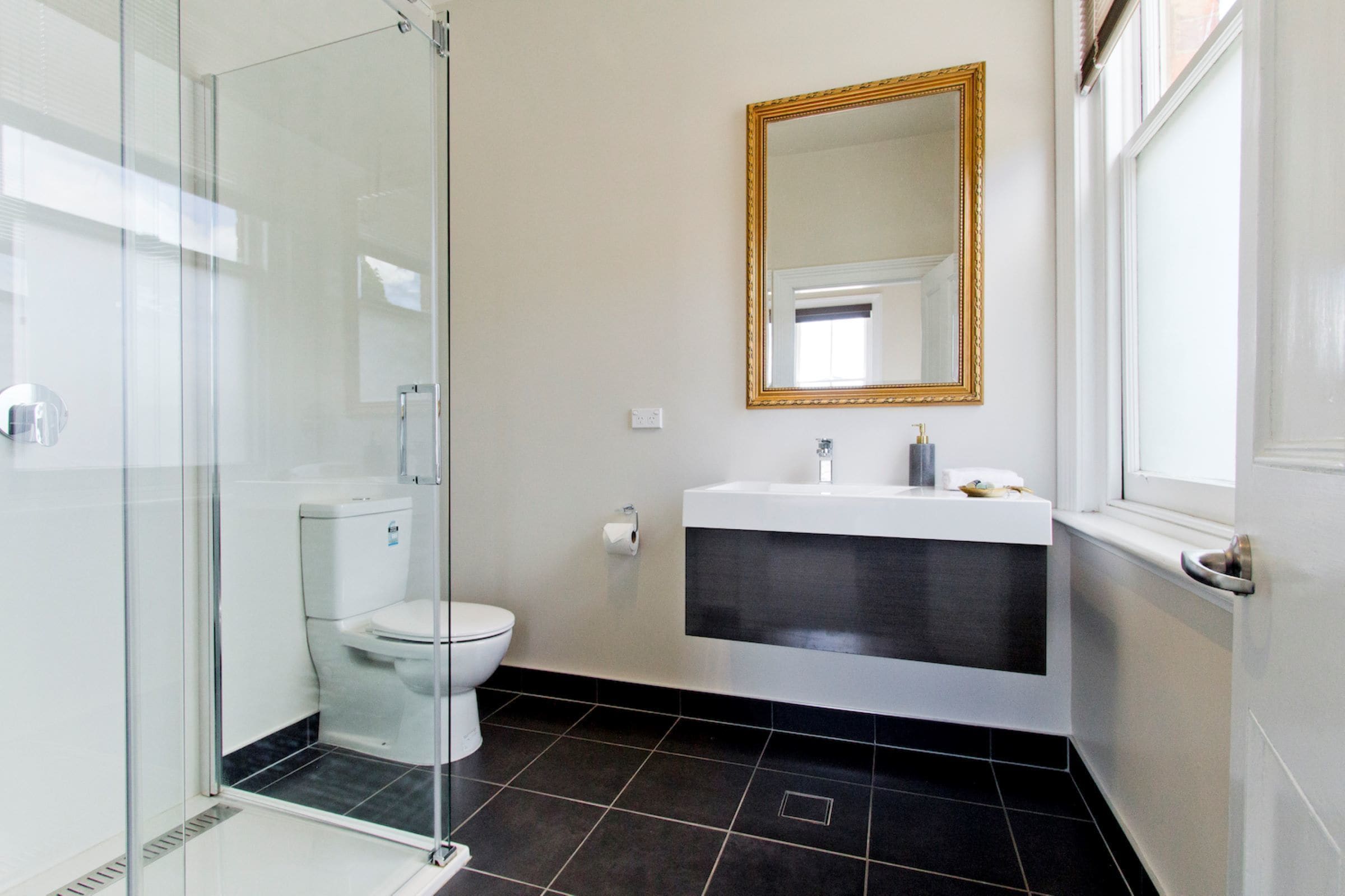 family room, shared bathroom | bathroom amenities | shower, free toiletries, towels