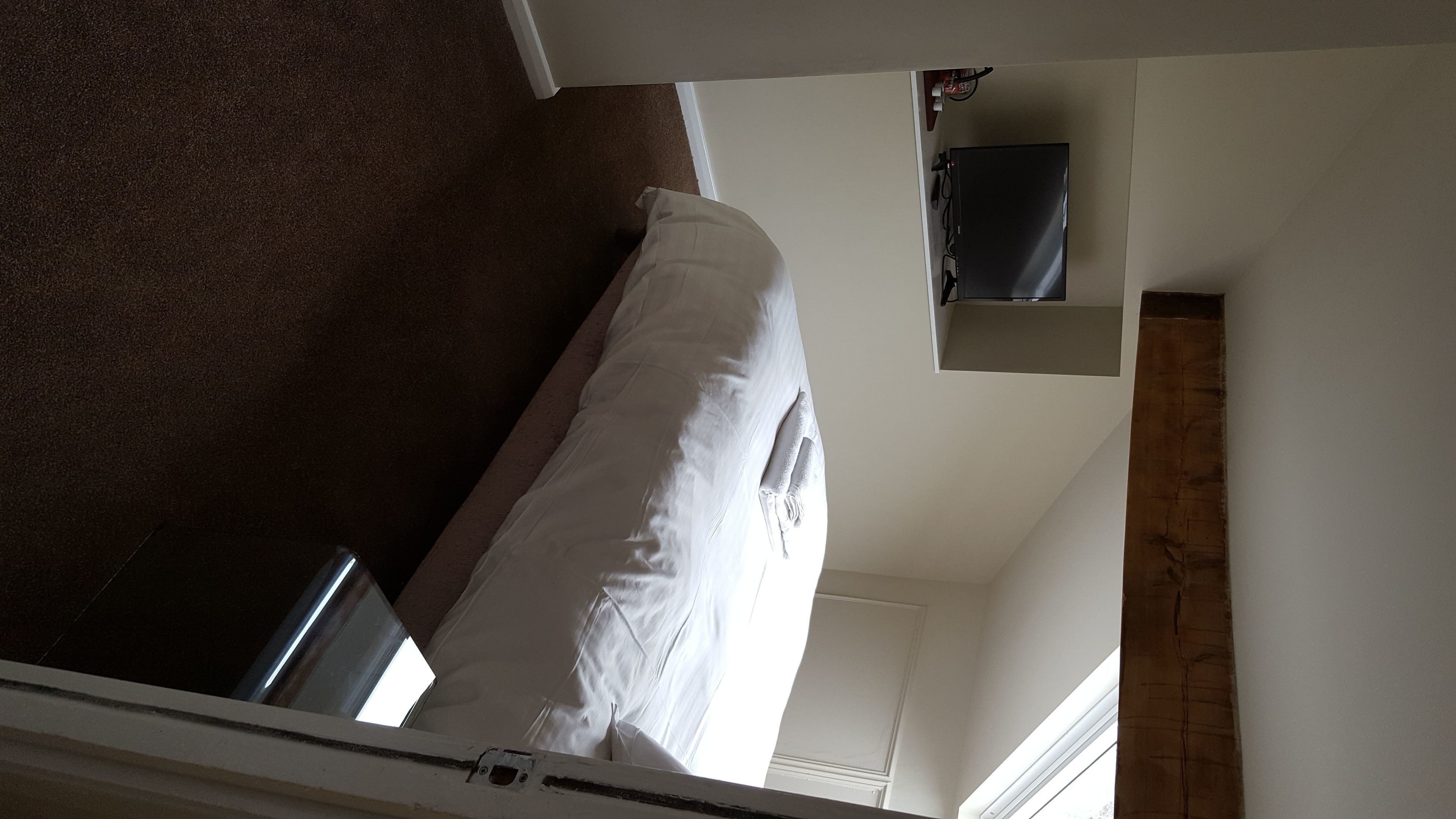 superior single room, 1 bedroom, city view | premium bedding, desk, laptop workspace, iron/ironing board