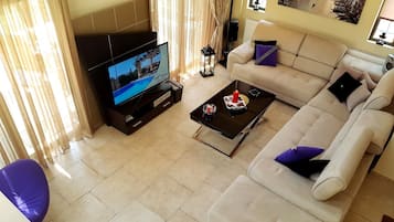 Deluxe Villa, 4 Bedrooms, Mountain View, Poolside | Living area | 44-inch flat-screen TV with satellite channels, LED TV, fireplace