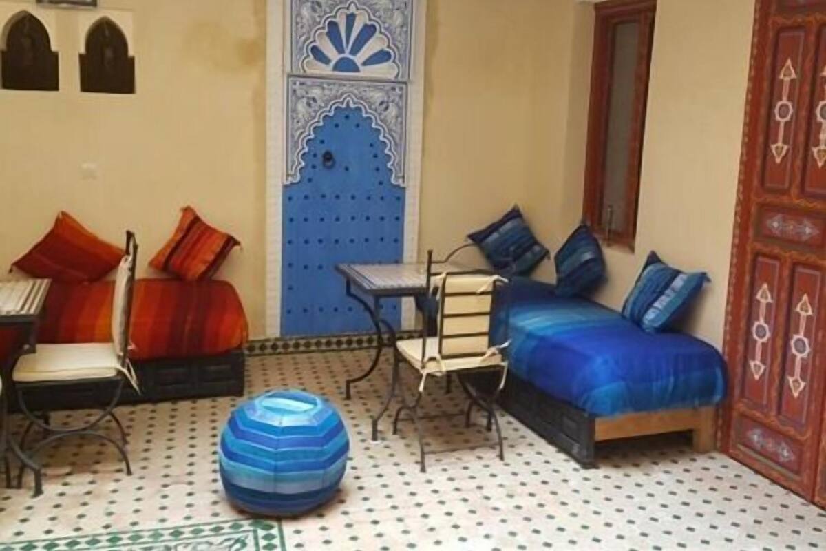 Suite Deluxe, baño privado | Área de sala de estar