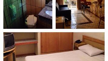 Suíte, 1 quarto | 1 quarto, frigobar, escrivaninha, cortinas blackout