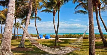 On the beach, sun loungers, beach towels