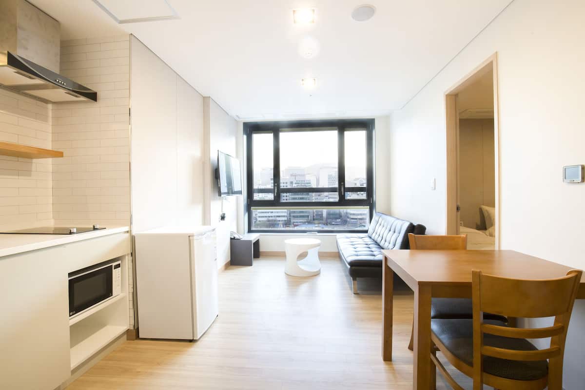 Family Studio Suite, 2 Bedrooms | Living room