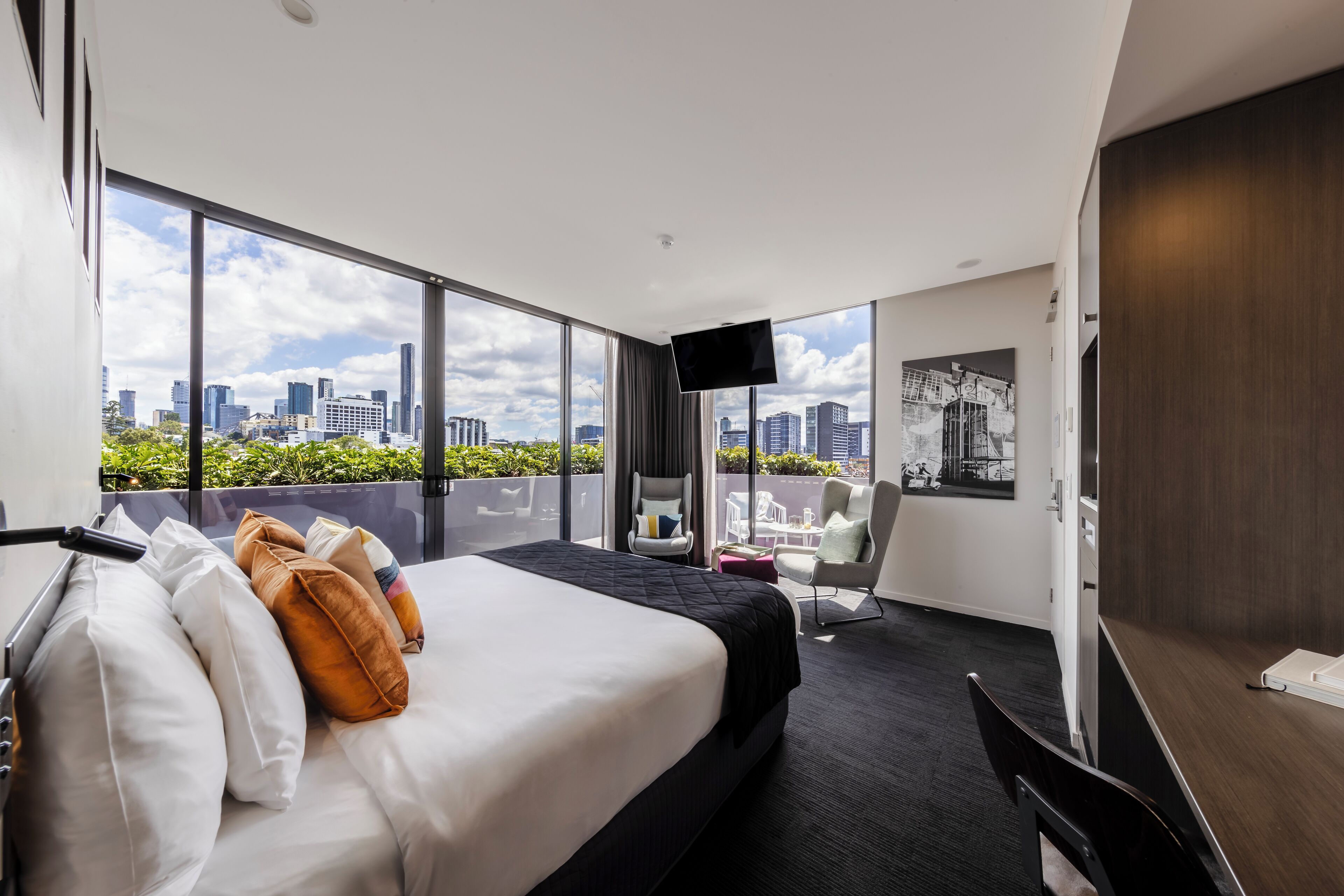 deluxe king city view | in-room safe, desk, laptop workspace, blackout curtains