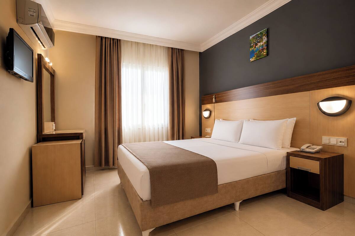 Chambre Économique, 2 lits une place | Minibar, bureau, rideaux occultants, chambres insonorisées