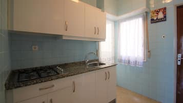 Apartment, 3 Bedrooms, Balcony | Private kitchenette | Full-size fridge, microwave, oven, stovetop