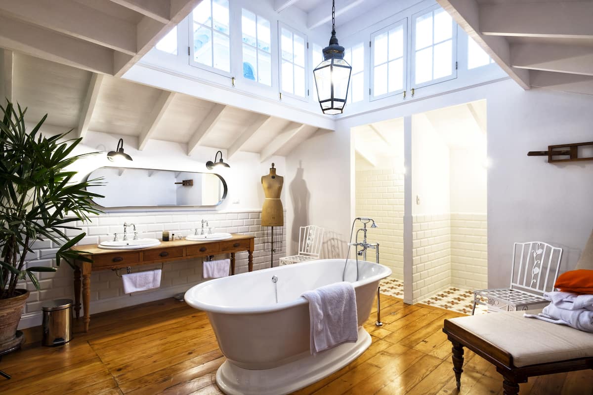 grand suite | bathroom | rainfall showerhead, designer toiletries, hair dryer, bathrobes