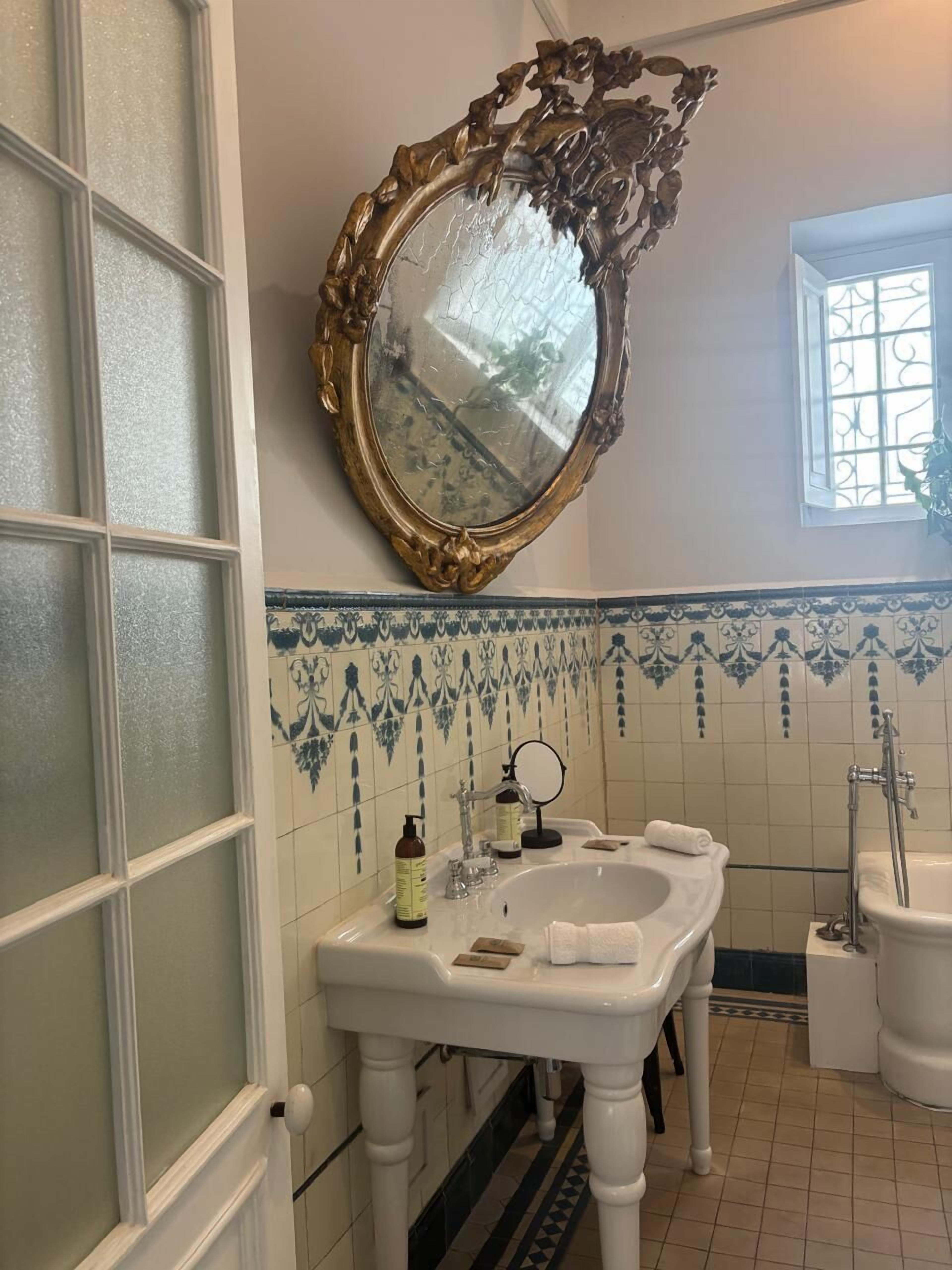 grand suite | bathroom | rainfall showerhead, designer toiletries, hair dryer, bathrobes