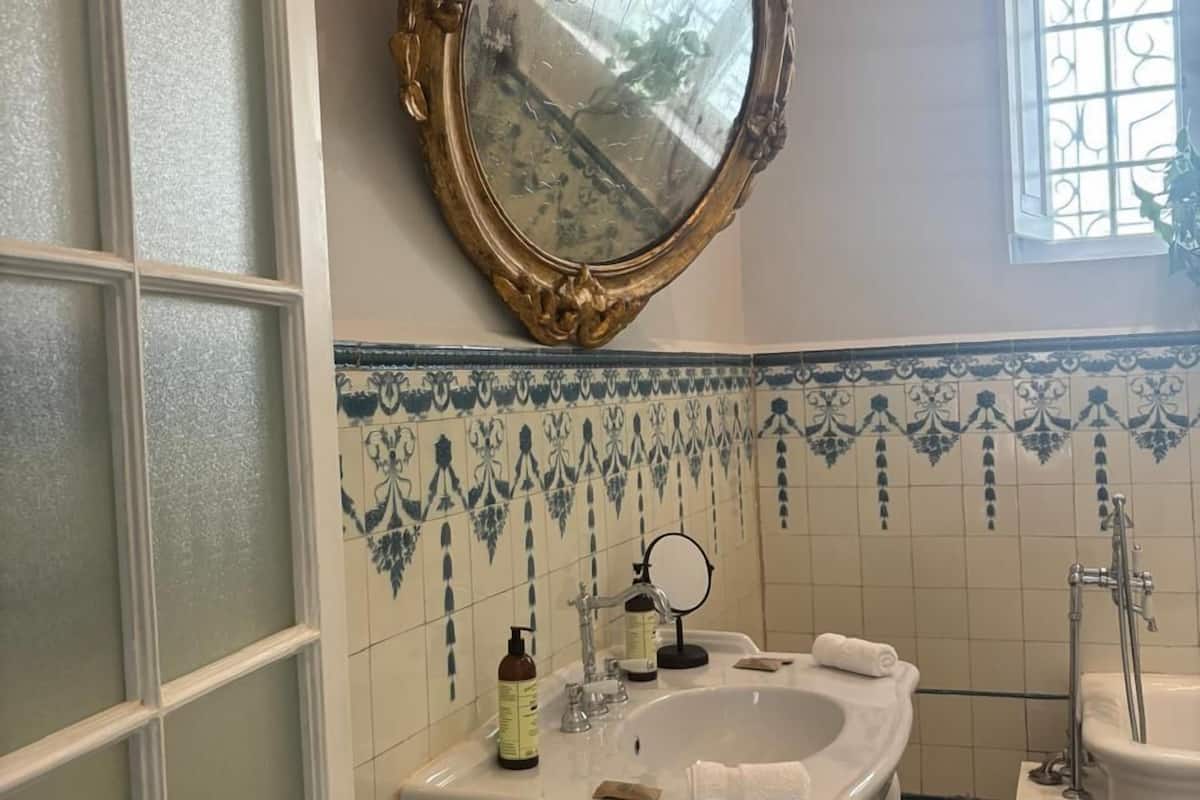 grand suite | bathroom | rainfall showerhead, designer toiletries, hair dryer, bathrobes