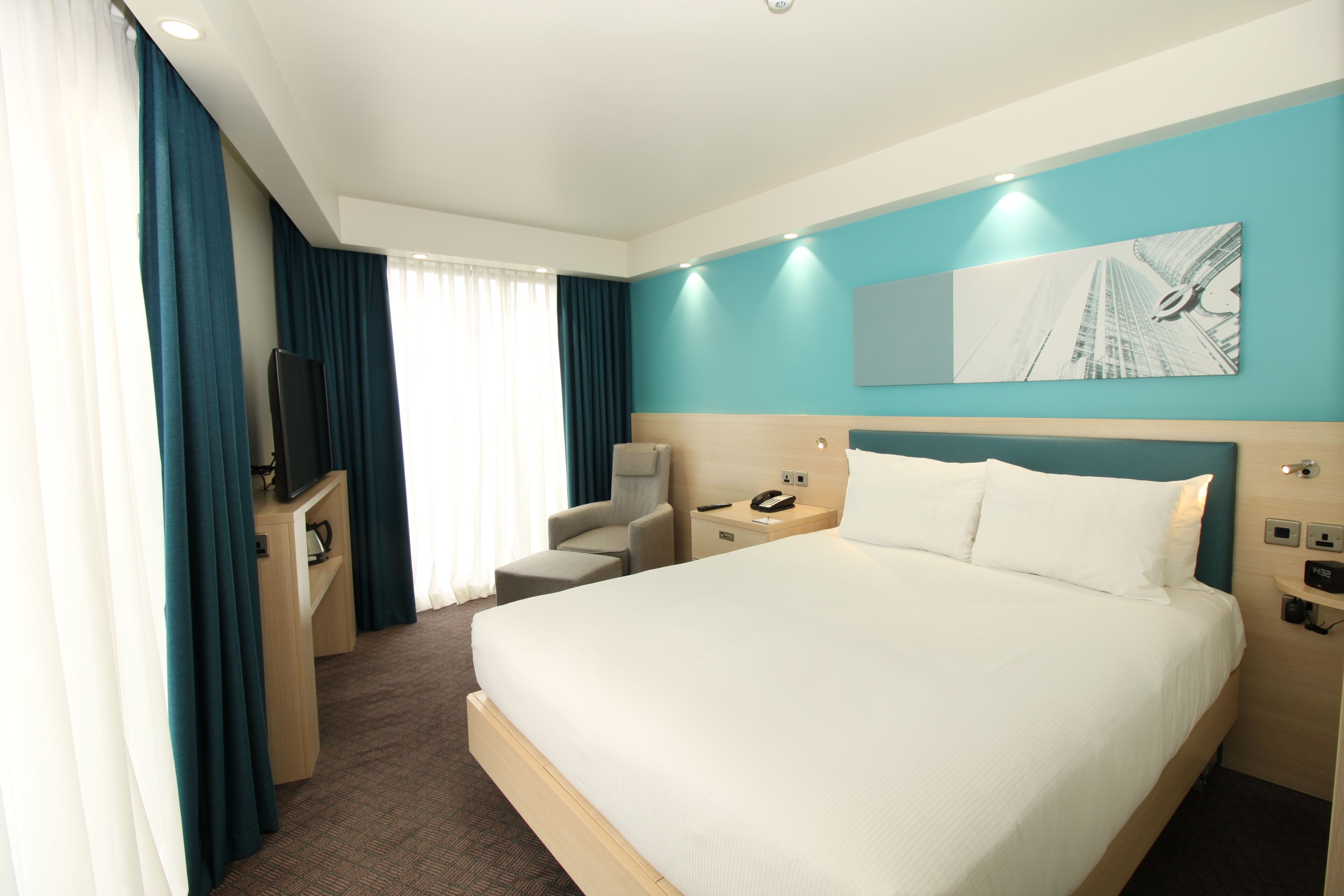 deluxe room | in-room safe, desk, laptop workspace, blackout curtains