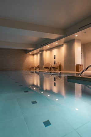 Indoor pool, open 6:00 AM to 10 PM, pool loungers