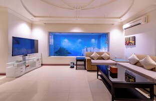 Standard Villa Without View | Living area | 50-inch TV with satellite channels