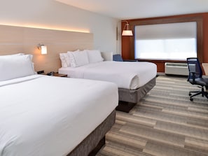 A hotel room with two beds, a desk, a chair, and a large window. - Holiday Inn Express & Suites Brighton South - US 23 by IHG (Brighton)