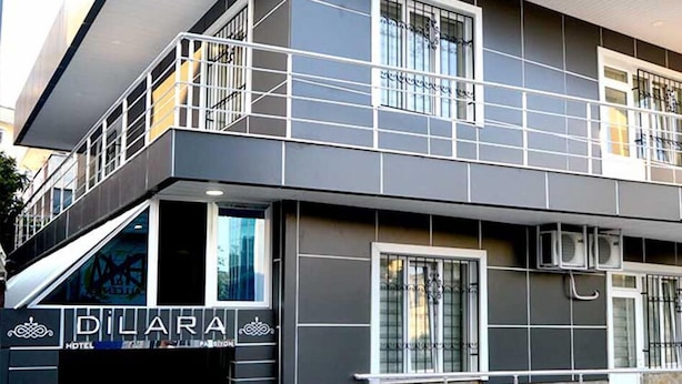 A hotel named "DILARA" with a modern design, featuring balconies and large windows. - Dilara Hotel (Antalya)