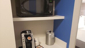 A kitchenette with a microwave, coffee maker, and refrigerator. - Holiday Inn Express & Suites Brigham City - North Utah by IHG (Brigham City)