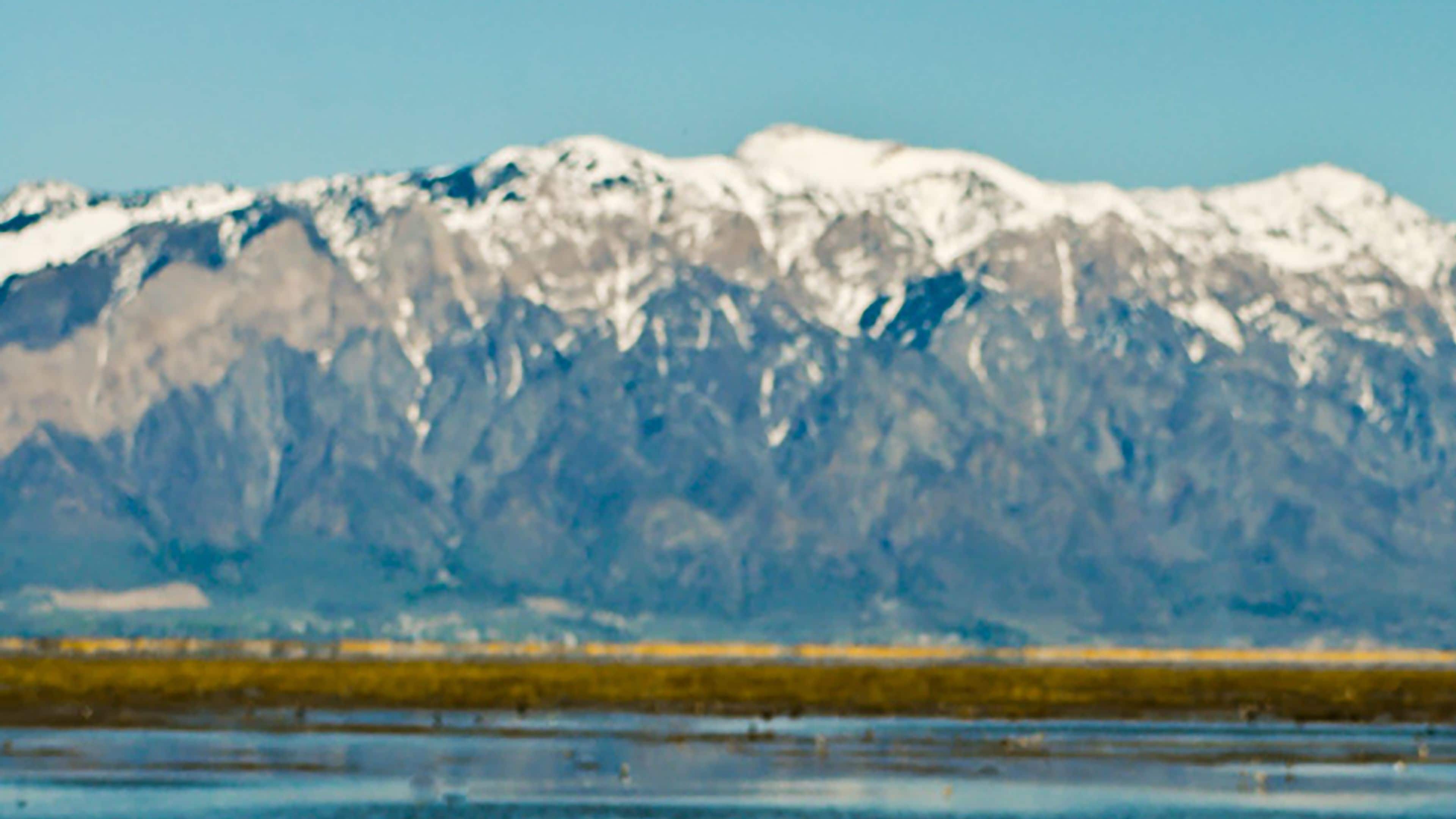 A mountain range with snow-capped peaks.