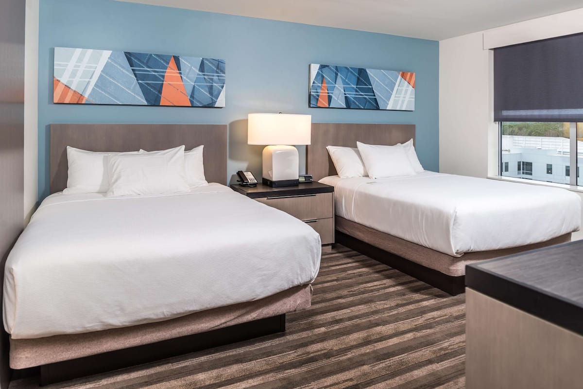 suite, 1 bedroom (2 queen & 1 sofa bed) | in-room safe, desk, blackout curtains, iron/ironing board