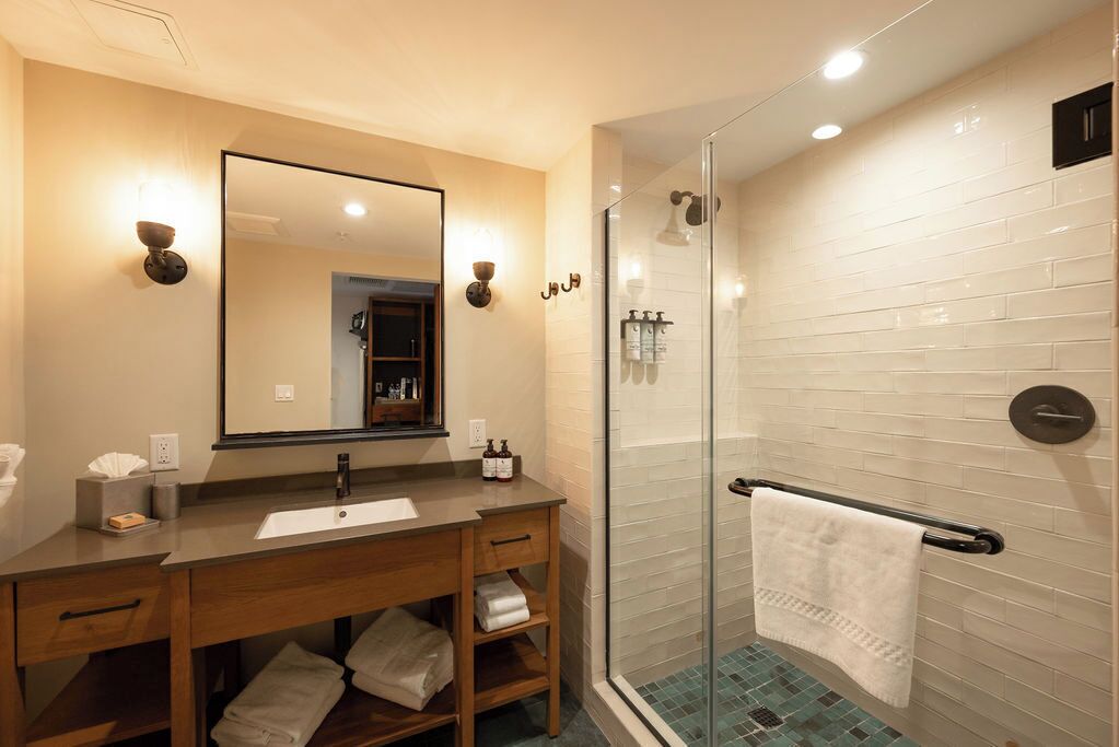 Shower, designer toiletries, hair dryer, bathrobes