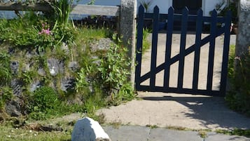 A gated entrance to a building with a sign indicating no vacancies.
